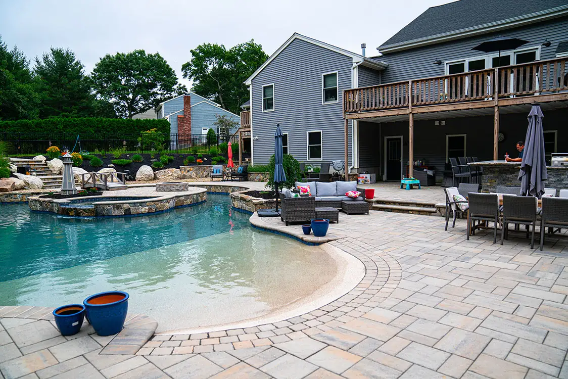 A finished luxury custom gunite pool with custom masonry in New England A finished luxury custom gunite pool with custom masonry in New England