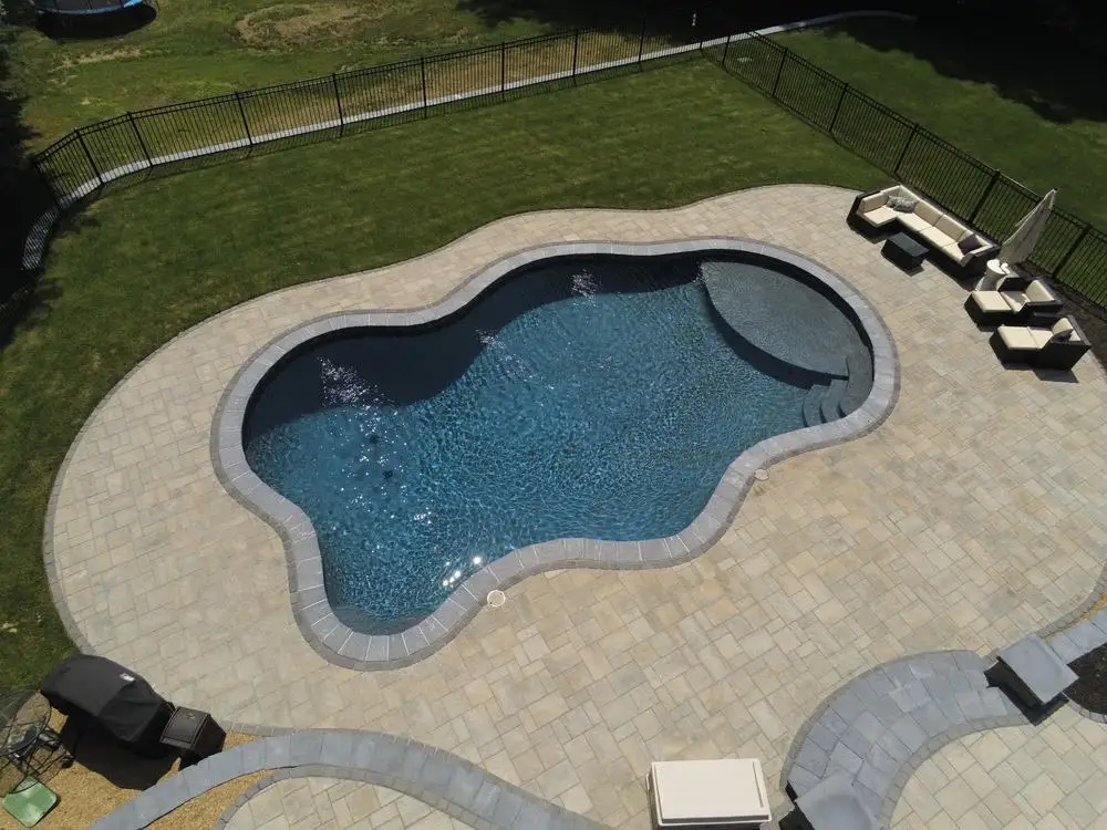 modern geometric pool with clean lines and a tanning ledge - beautiful home pools