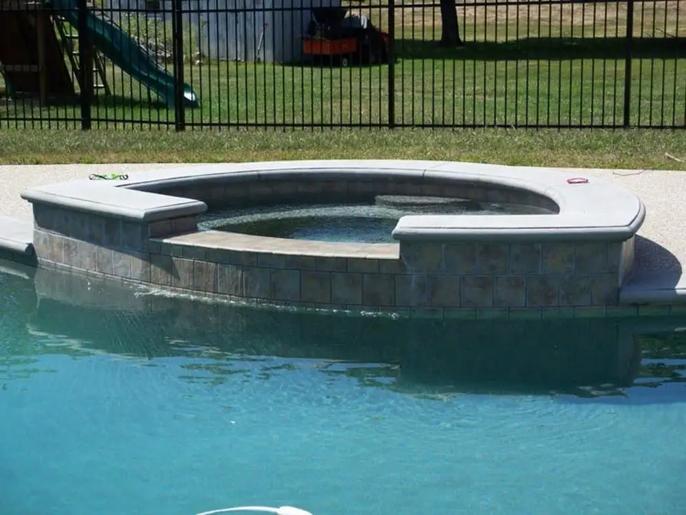 in-ground gunite pool with custom spa integration in-ground gunite pool with custom spa integration