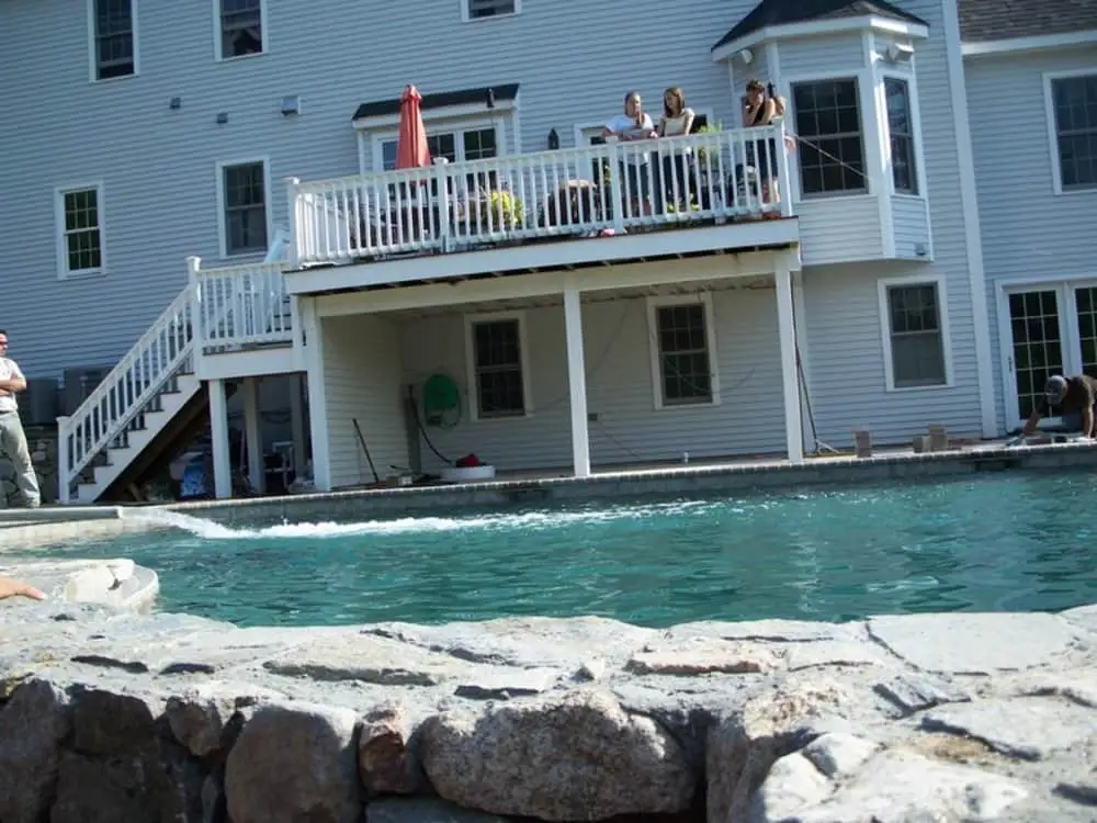 professionally installed pool deck with safety railings