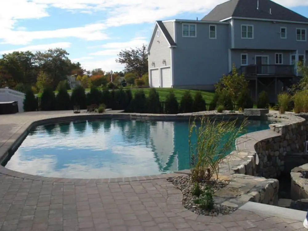 completed luxury gunite pool with custom masonry and hardscaping