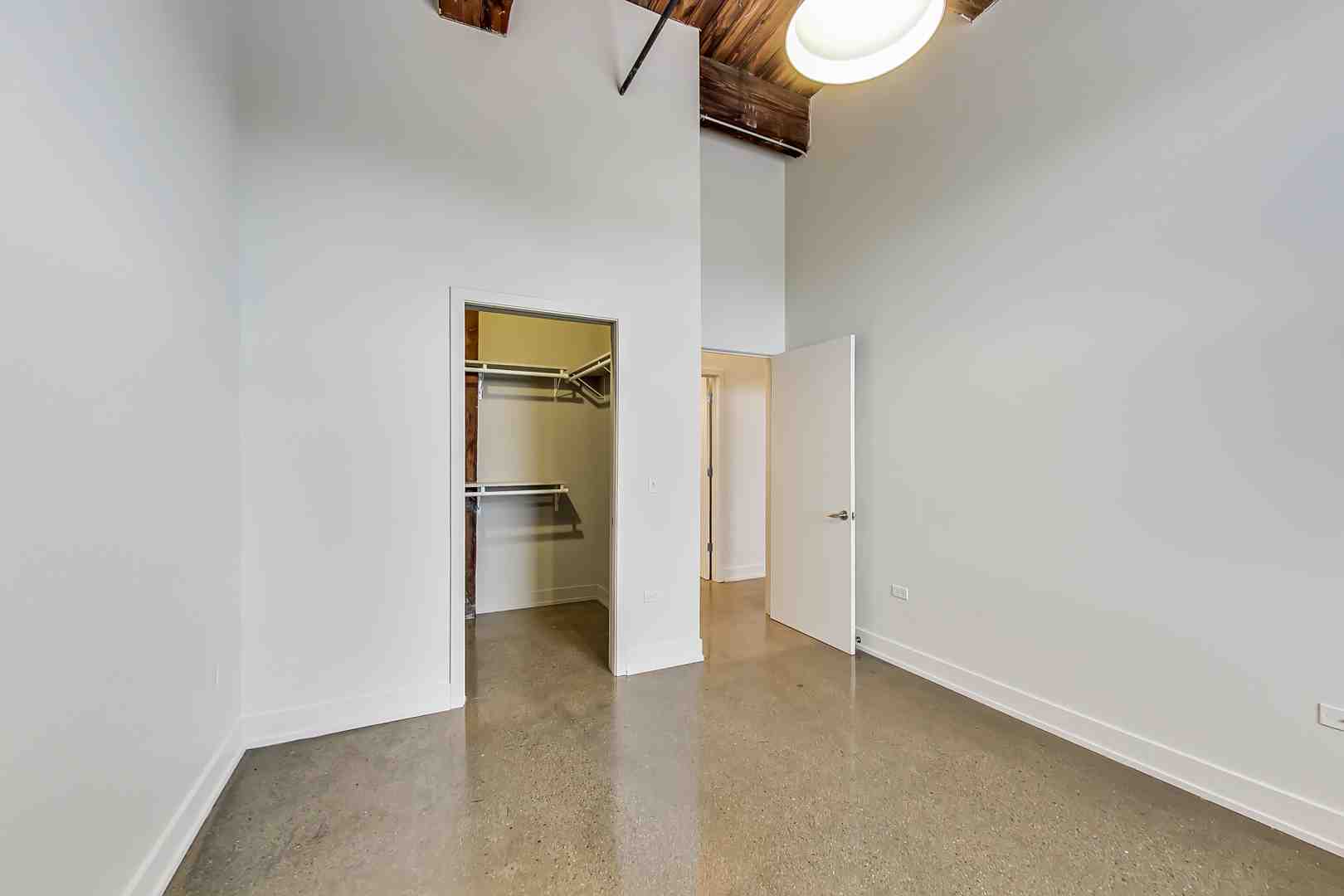 Well-lit studio apartment showing a clear, open layout - Studio apartment benefits