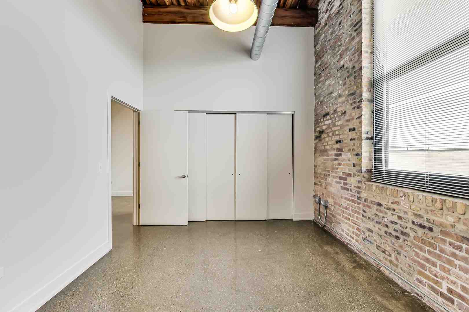 Vibrant street scene in Fulton Market, showcasing a mix of old warehouse buildings and new construction - chicago warehouse lofts for rent