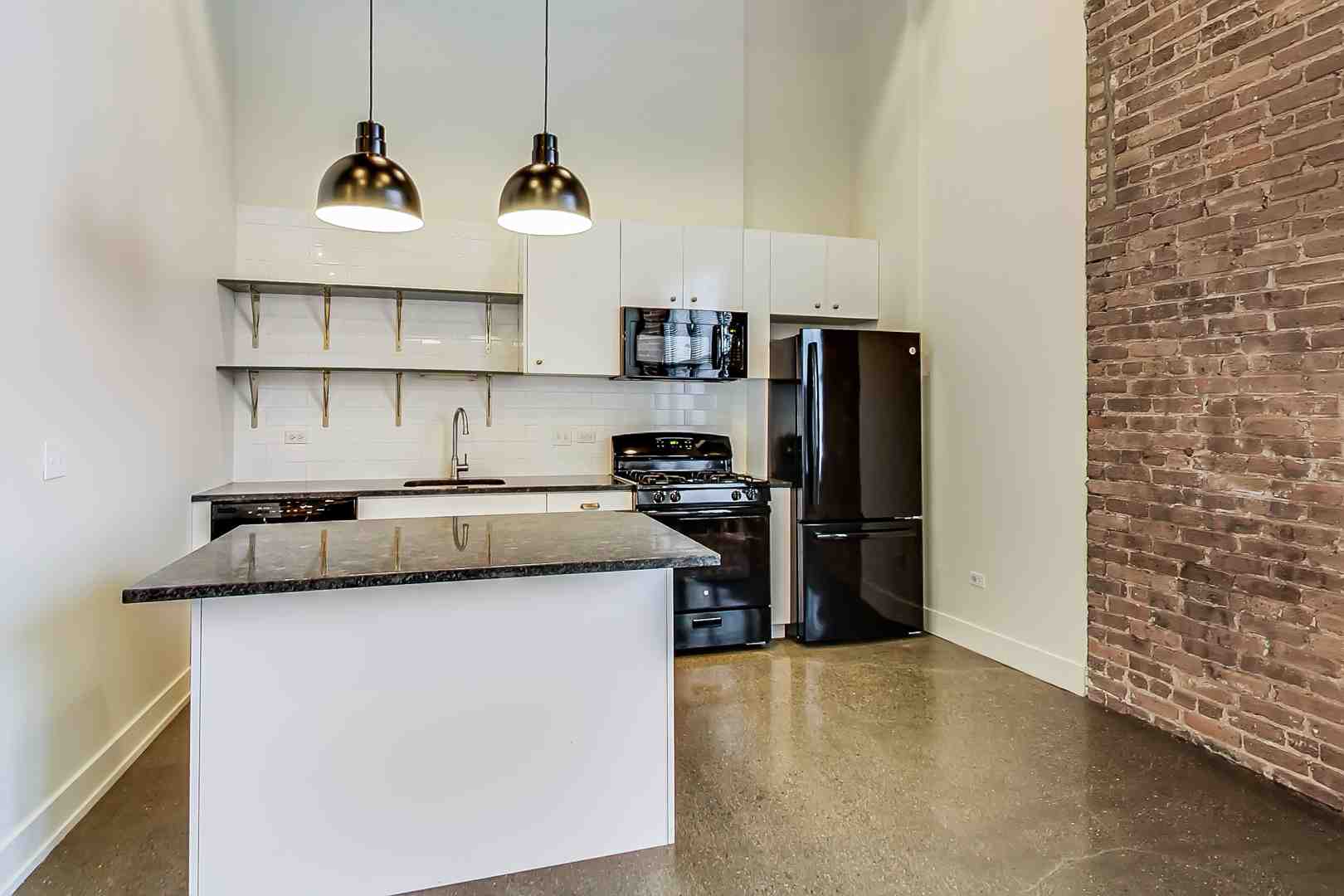 A wall with floating shelves and a gallery wall extending to the ceiling - Studio apartment ideas