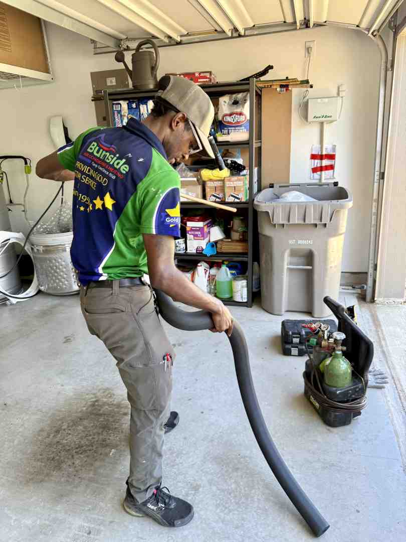 a technician inspecting a home utility system