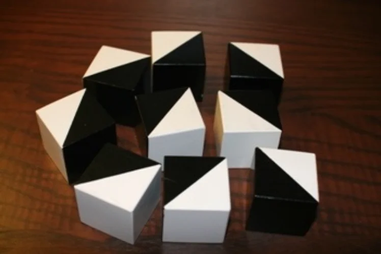 Close up of bi-color test prep blocks showing white, blue, and diagonal split sides - Block design ERB