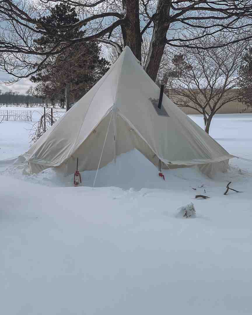 wall tent with a stove in a snowy, wooded environment - tents and canvas