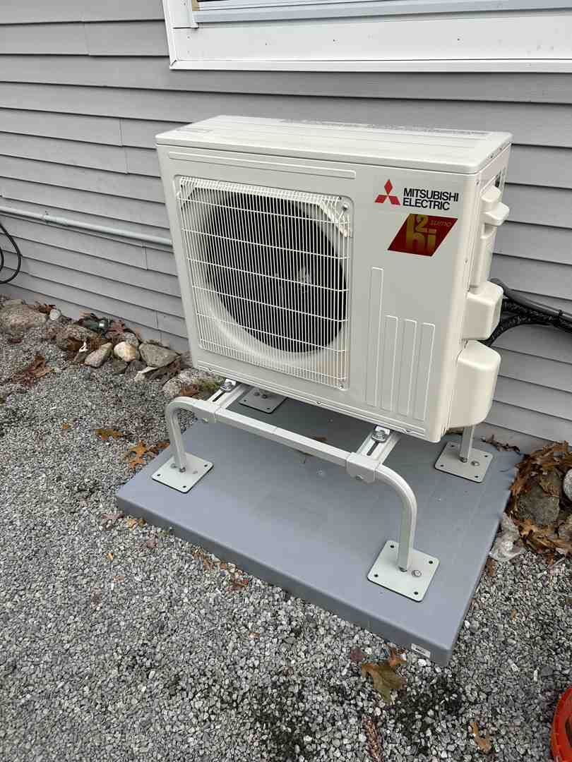 HVAC technician installing a high-efficiency heat pump system in a residential home