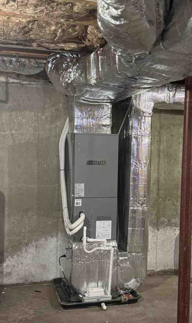 professional HVAC technician inspecting a furnace in May 2026 - emergency furnace repair