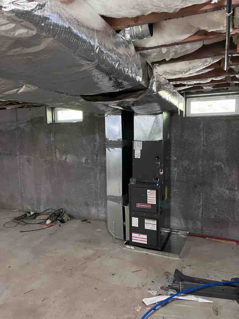 HVAC technician installing a new gas boiler in a residential basement - gas boiler replacement HVAC technician installing a new gas boiler in a residential basement - gas boiler replacement
