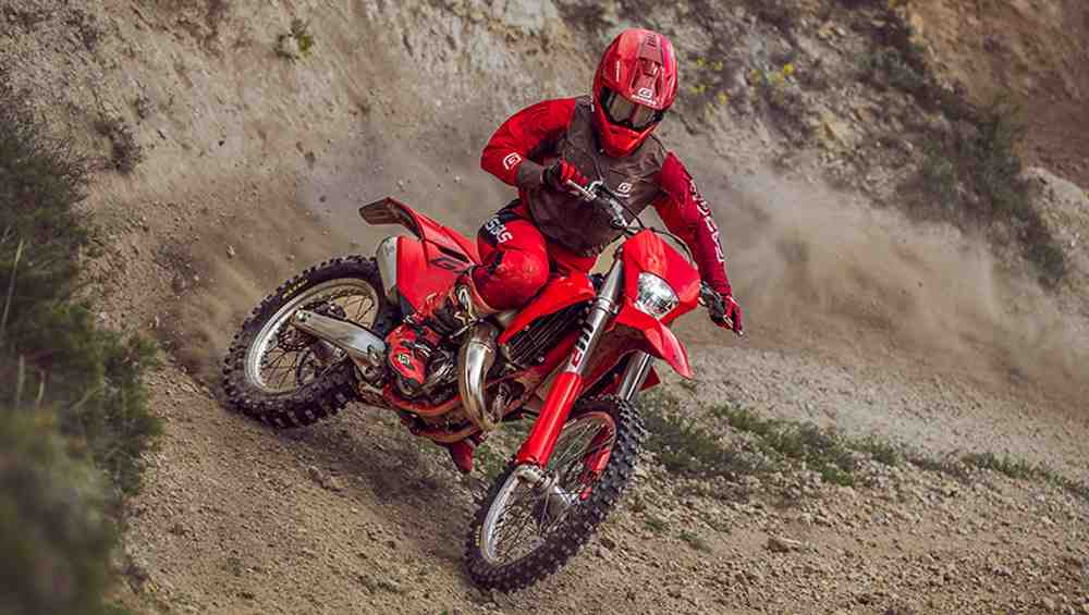 GasGas EX 300 navigating a forest trail - gasgas dirt bikes