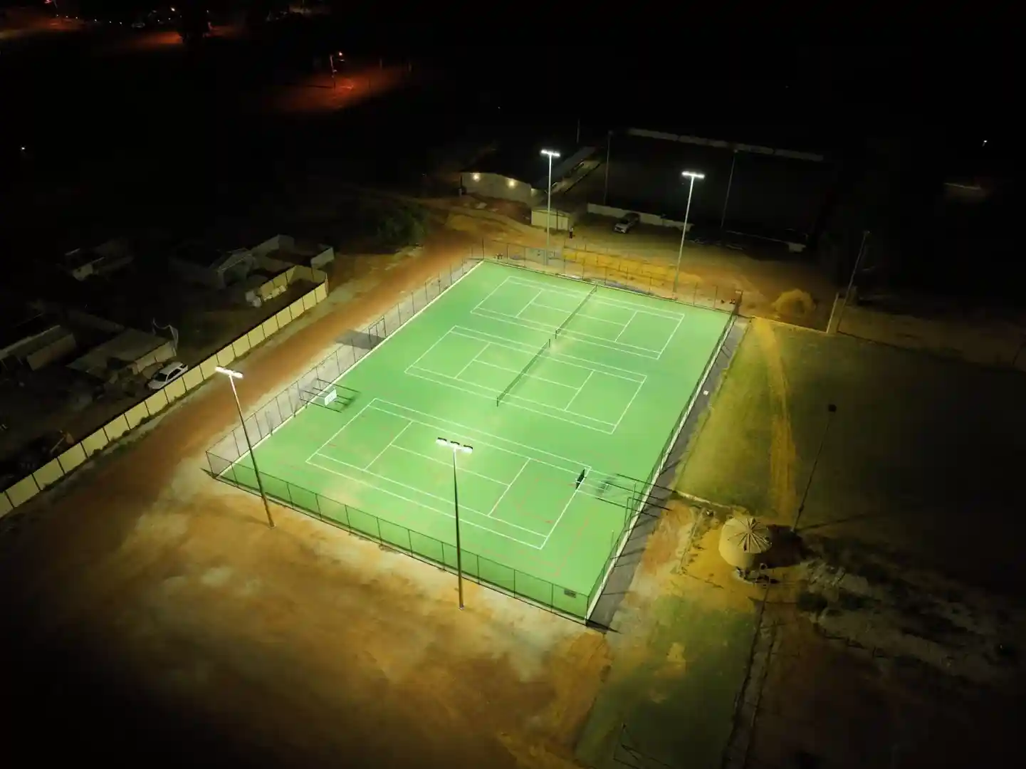 Well-lit tennis court showing uniform illumination and proper glare control - led flood light for tennis court