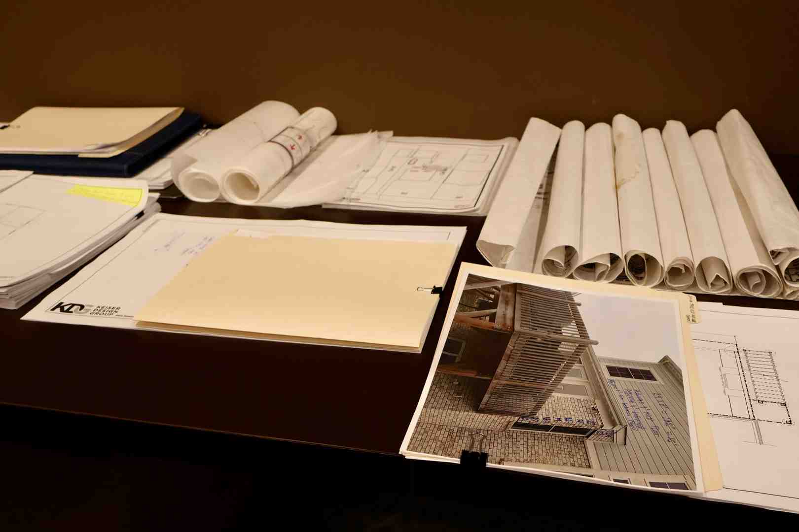 Detailed architectural blueprints with a professional compass showing precision in design - Tennessee Architecture