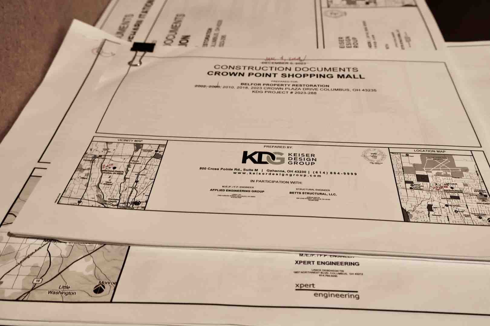 An architectural blueprint with official stamps and signatures - renovating a commercial building
