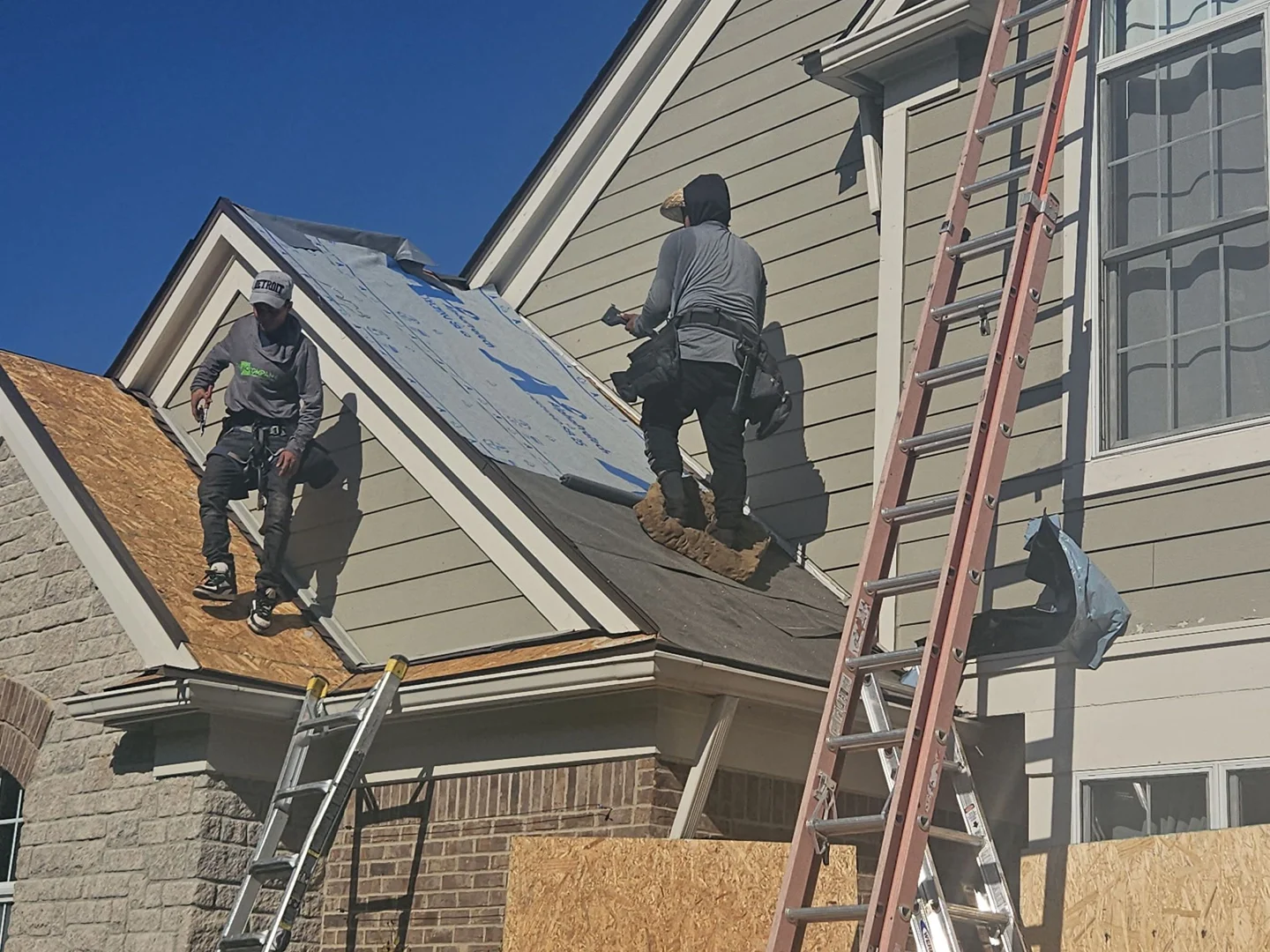 Commercial roofing crew working on commercial roof
