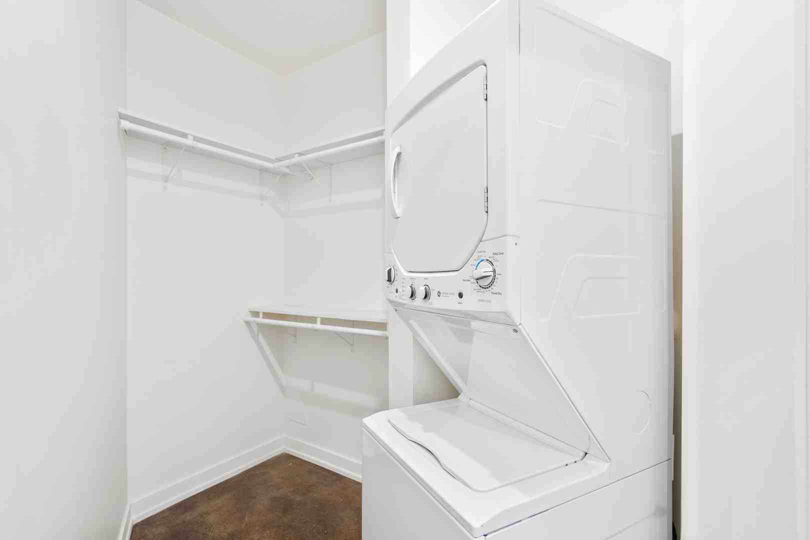 Modern apartment interior with in-unit laundry and high-end finishes