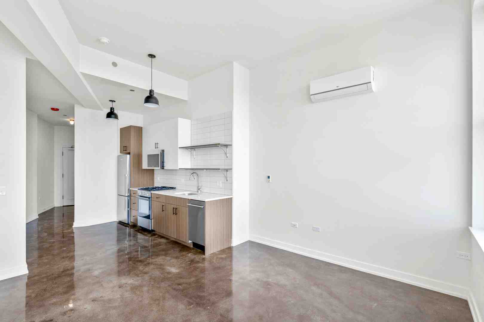 Modern kitchen featuring custom millwork and stone surfaces - Luxury apartments for lease