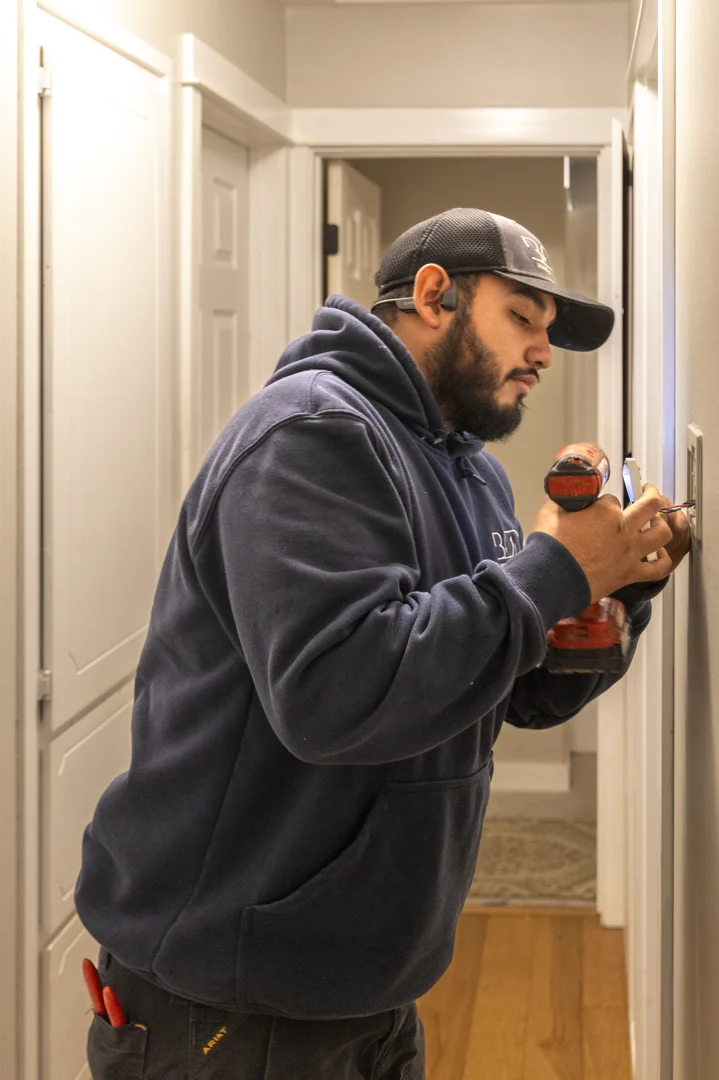 certified electrician replacing vintage knob-and-tube wiring