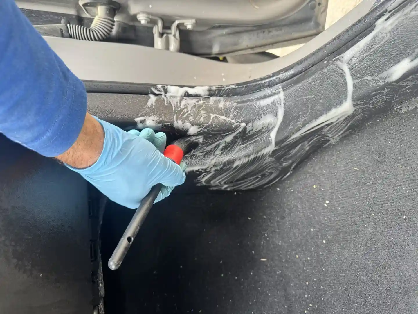 Cleaner Bros detailer carefully cleaning a car's interior - car detailing provo ut