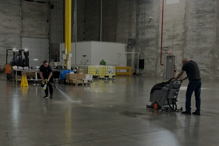 industrial floor scrubber drying concrete aisles in a commercial warehouse industrial floor scrubber drying concrete aisles in a commercial warehouse