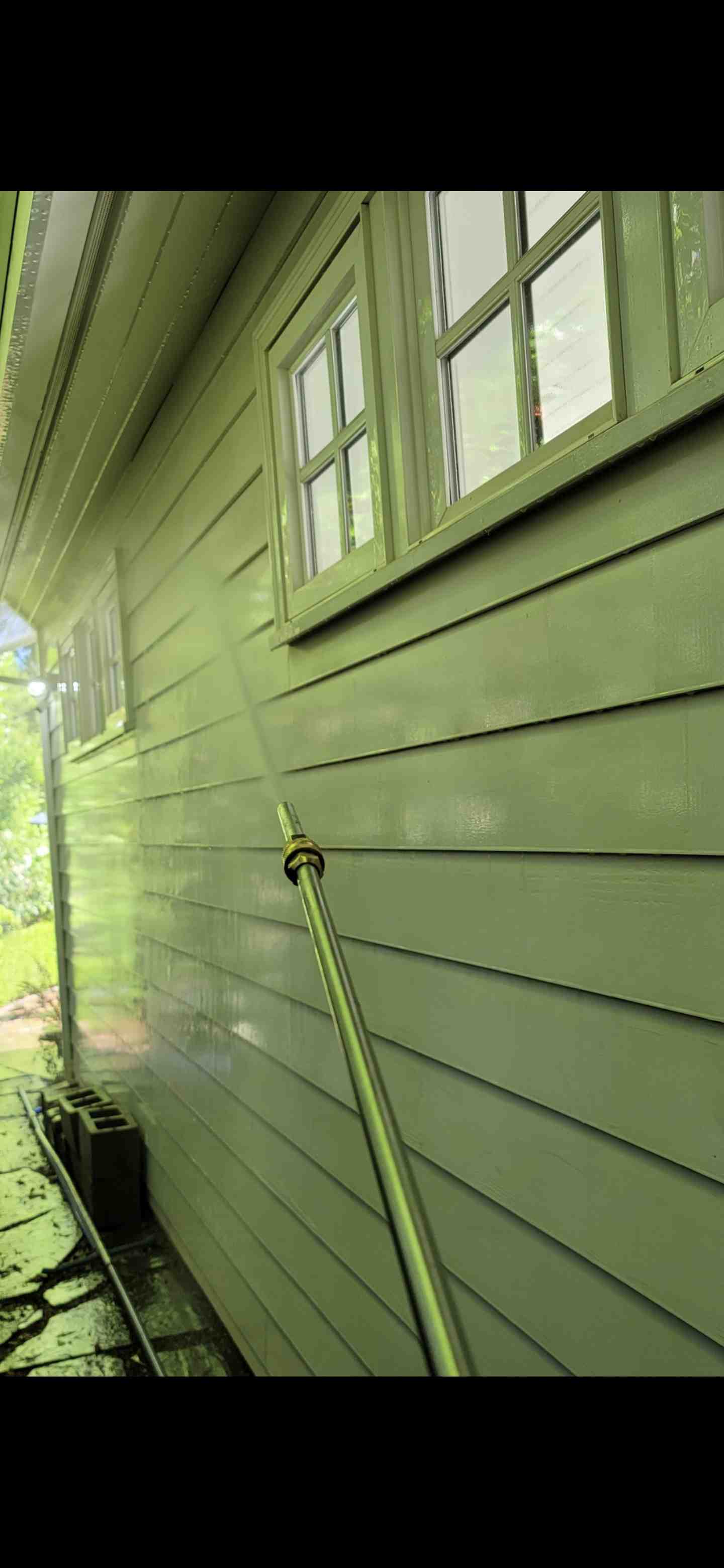 Soft washing wood siding - cleaning building exterior