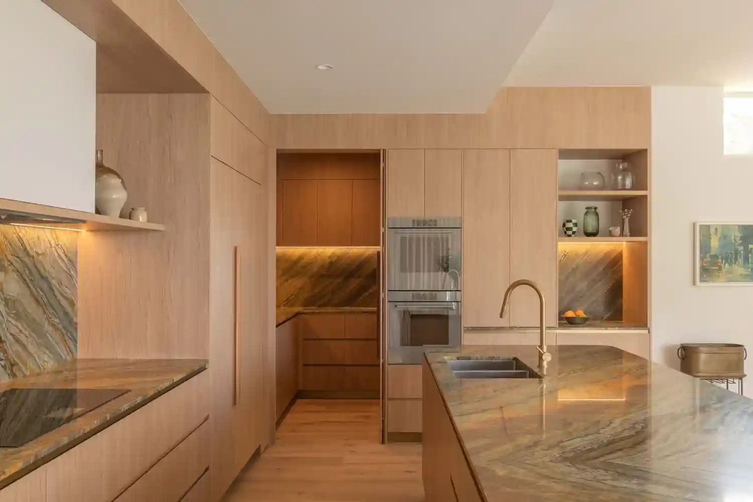 A beautifully organised kitchen space with custom cabinetry and integrated appliances, showcasing the quality of G&M Craftsman Cabinets' work. - laundry pantry closet ideas