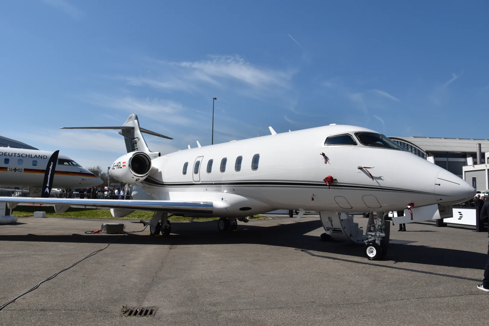 Bombardier Mobile Response Team vehicle on a flight line next to a Global jet - bombardier aircraft maintenance