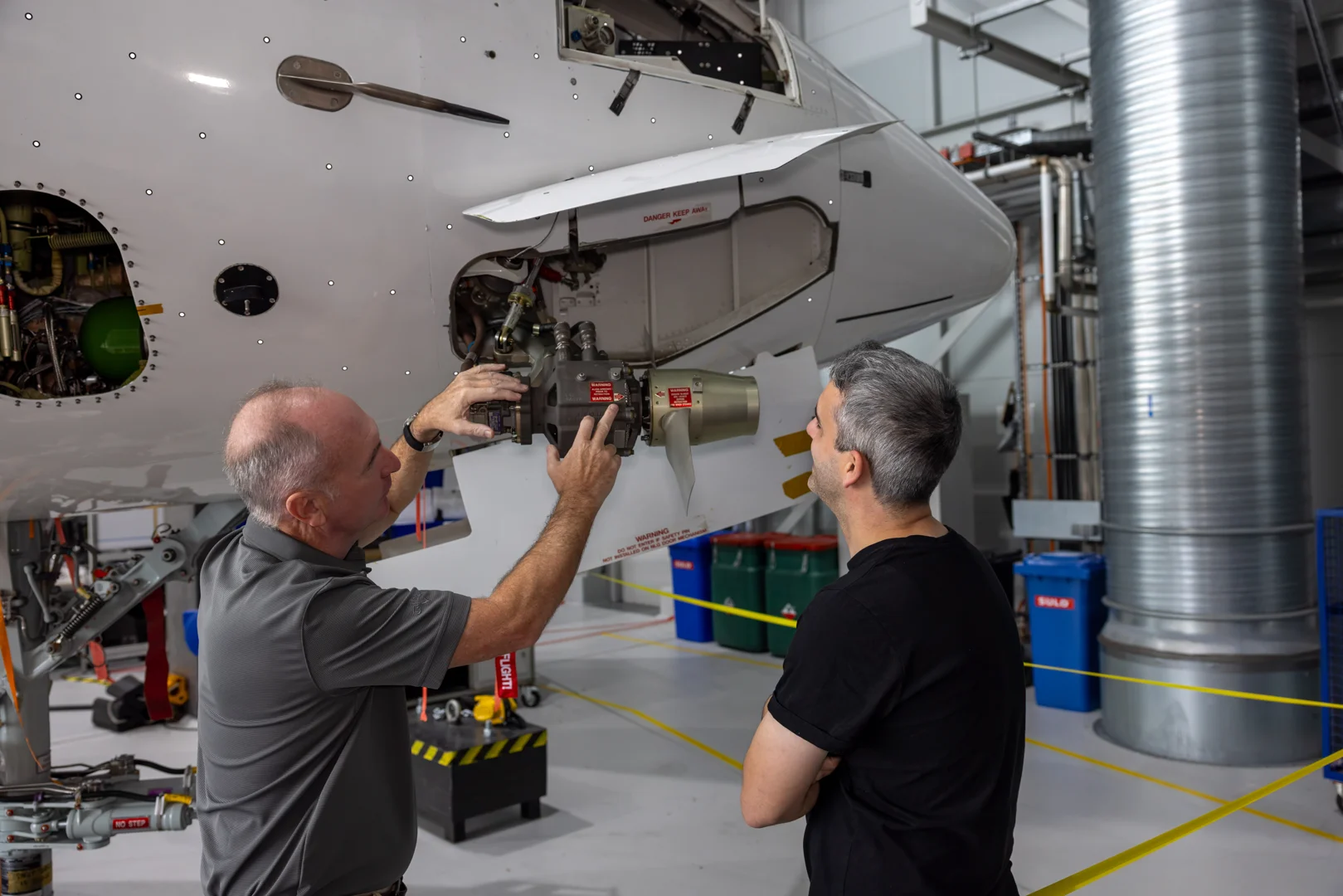 Instructor explaining a Ram Air Turbine (RAT) operation to a student