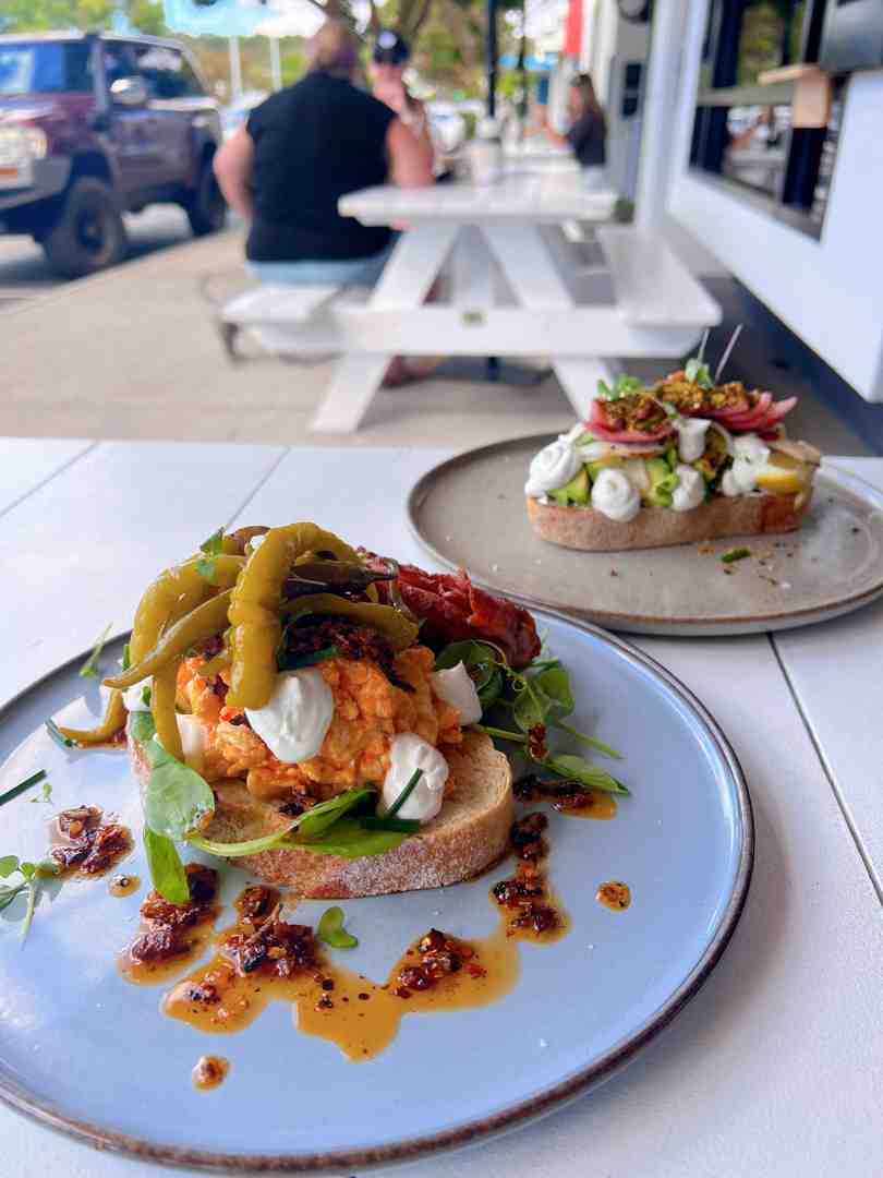 artisanal sandwiches sliced on a wooden board