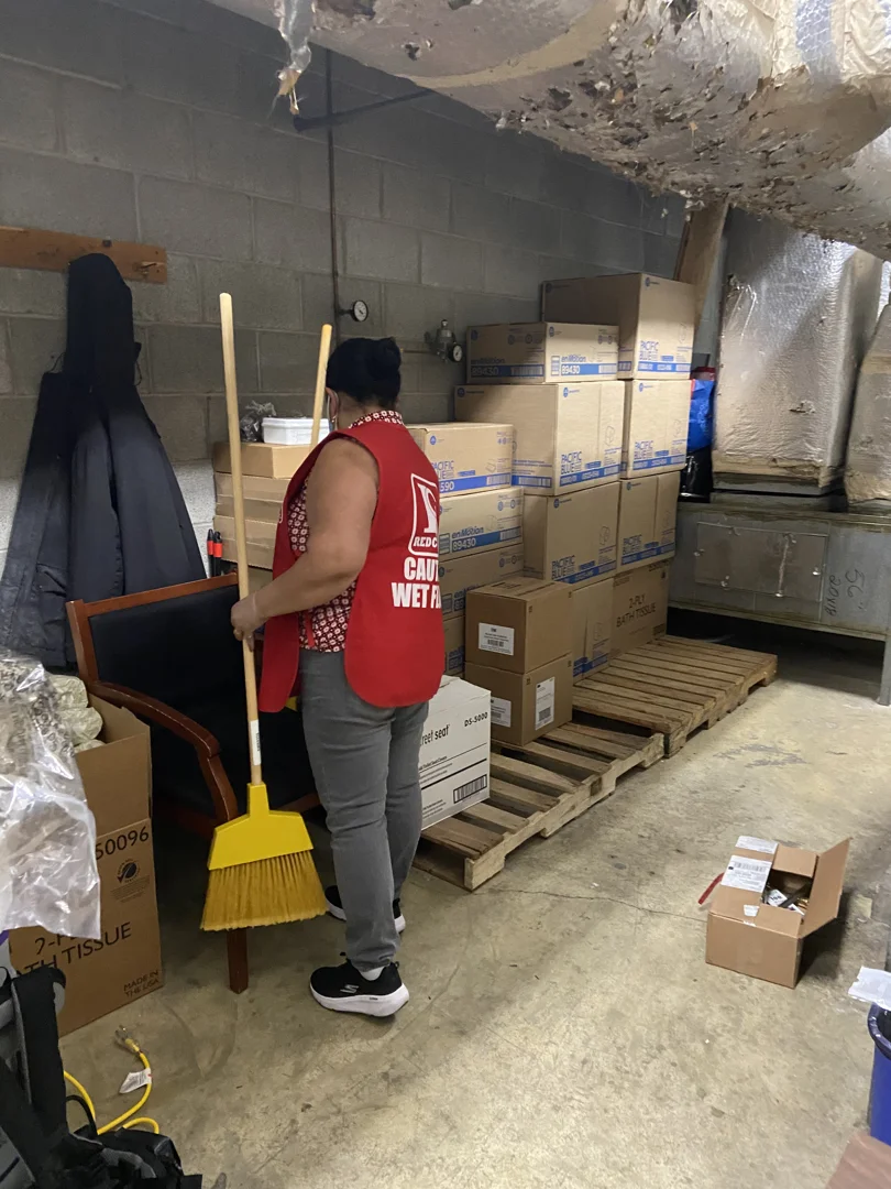 Red Coats cleaners rough cleaning a commercial renovation with dust and debris