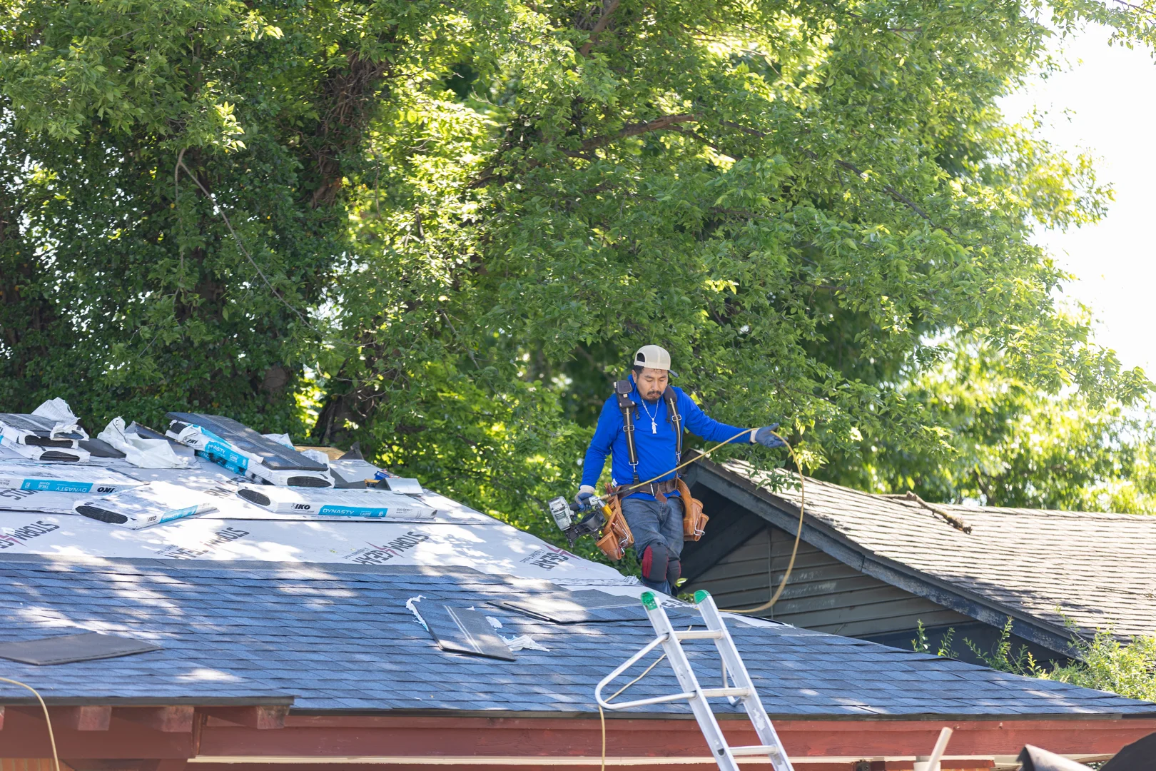 professional gutter contractor on ladder professional gutter contractor on ladder