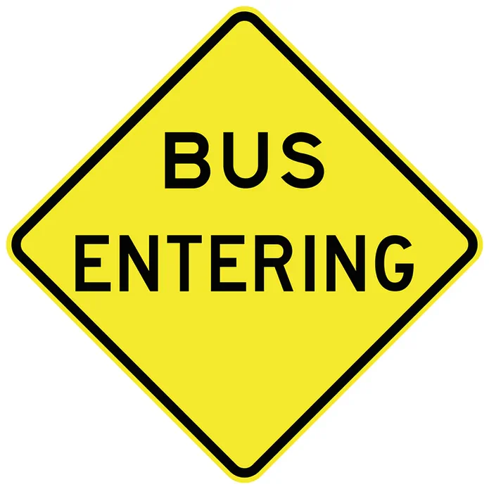 A diamond-shaped yellow warning sign with black text reading "BUS ENTERING," an essential component of bus lane signage.