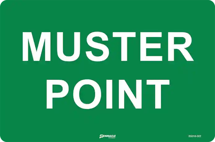 A green safety sign with bold white text reading "MUSTER POINT," used to identify an emergency muster point.
