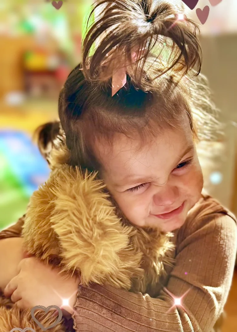 toddler resting quietly near a cozy calm-down space