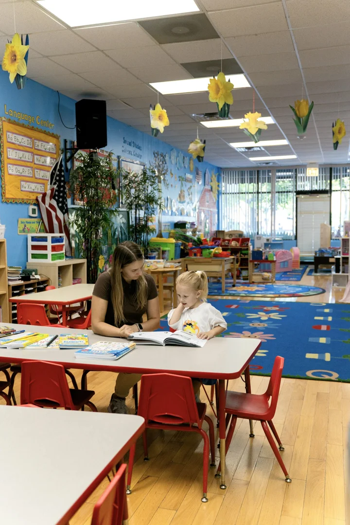 caregiver and toddler playing together