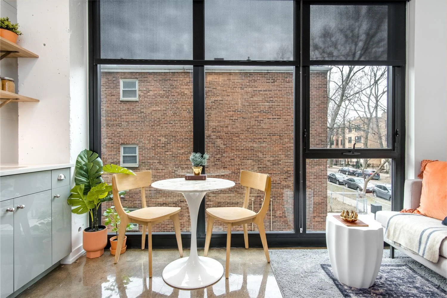 Modern open-concept living room with floor-to-ceiling windows and high-end finishes - modern upscale cook county