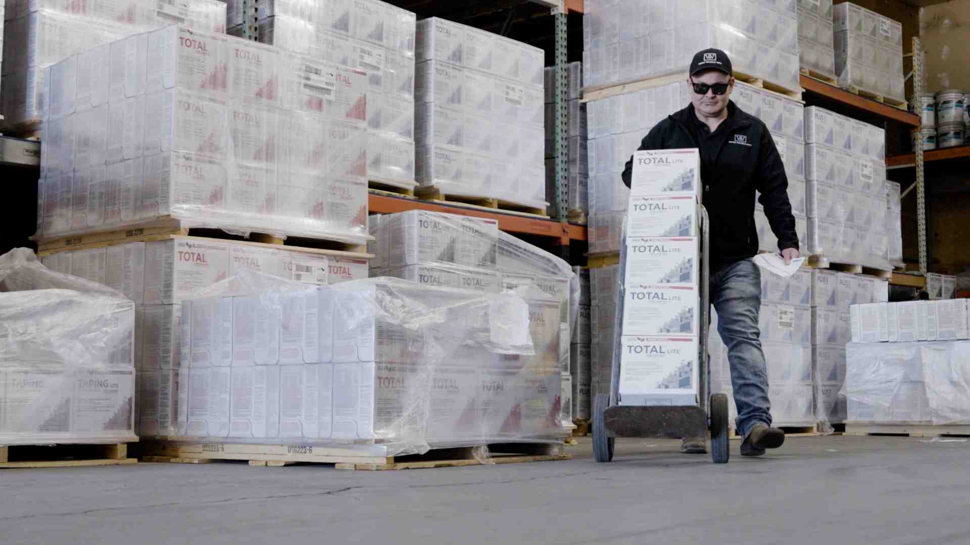 lightweight mud buckets stacked in a warehouse - lightweight drywall joint compound lightweight mud buckets stacked in a warehouse - lightweight drywall joint compound