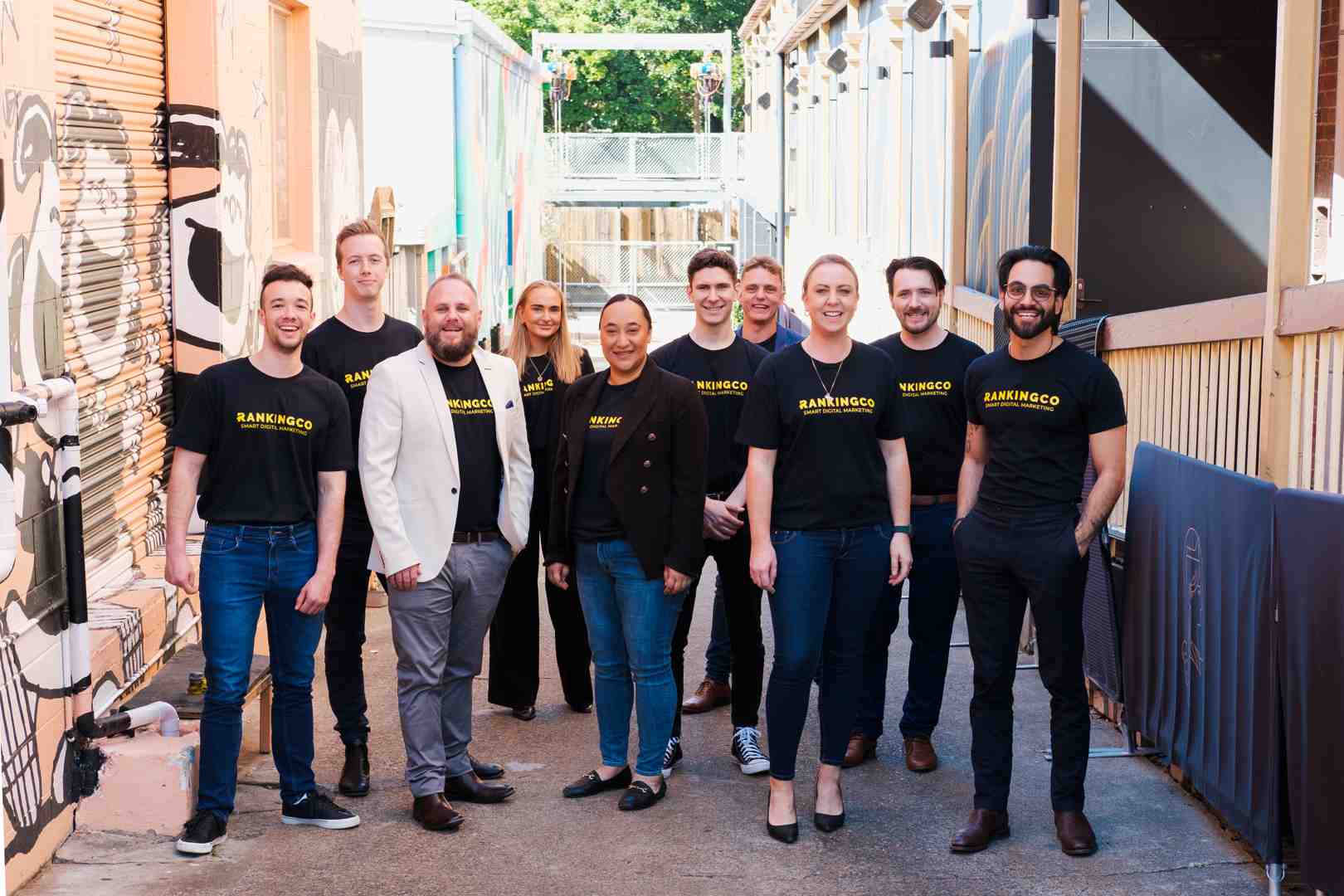 A diverse team collaborates around a digital marketing dashboard, showcasing teamwork and expertise - Google Ads expert consultant