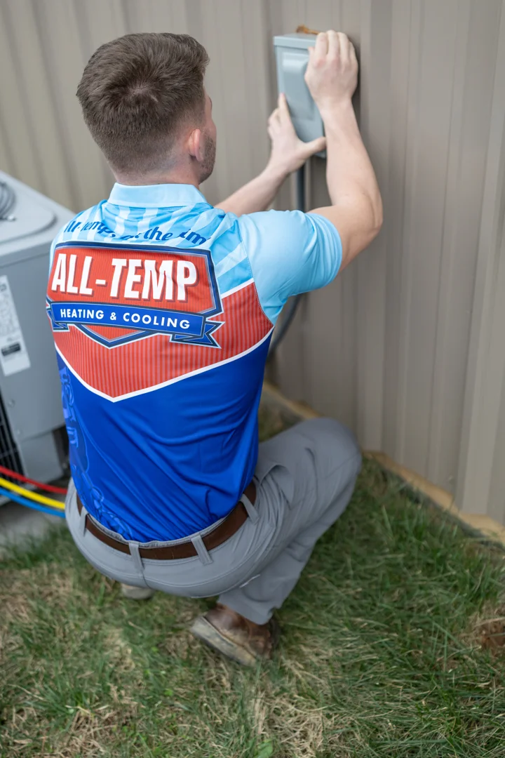 HVAC technician testing electrical components HVAC technician testing electrical components