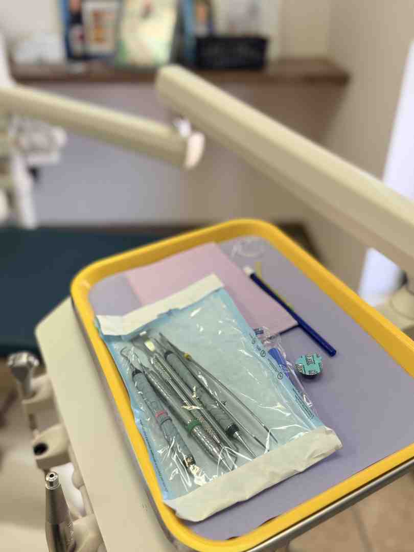 Dental instruments like scalers and mirrors on a sterile tray - scaling and polishing