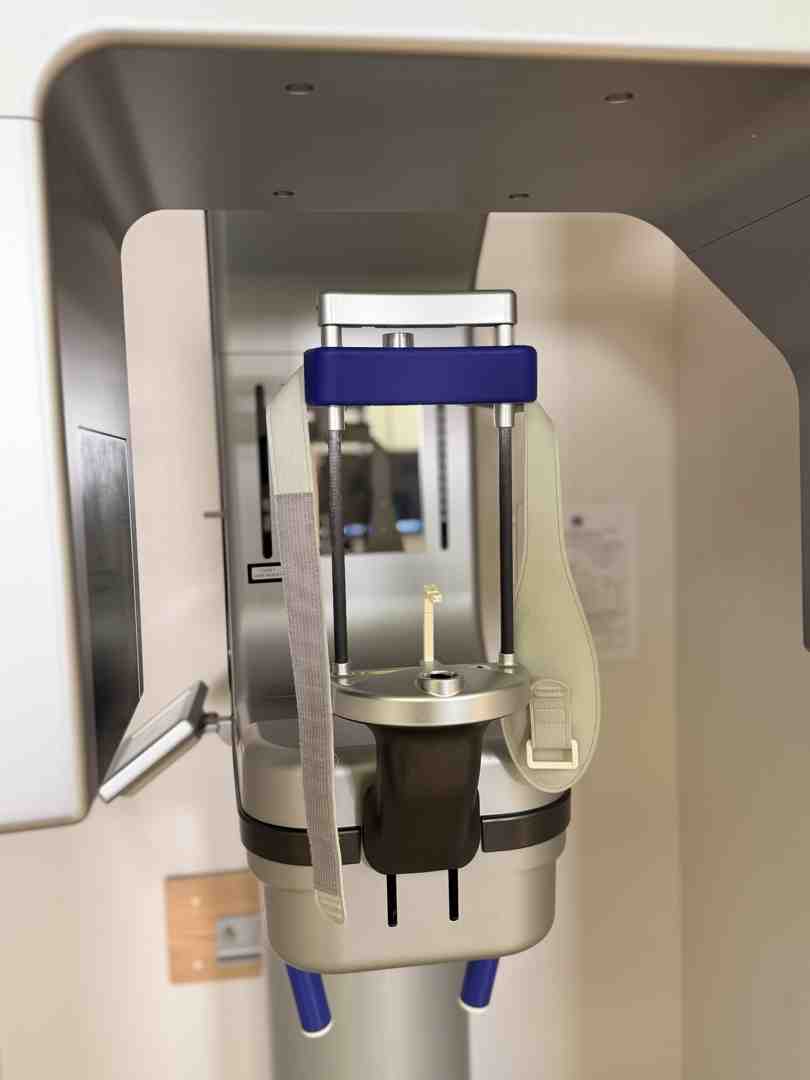 dentist pointing to x-ray with patient - does ahcccs cover emergency dental for adults dentist pointing to x-ray with patient - does ahcccs cover emergency dental for adults