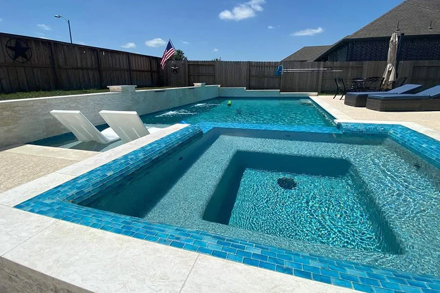 Pebble-finish pool reflecting the bright Texas sun in a Houston backyard - Pool replastering Houston Pebble-finish pool reflecting the bright Texas sun in a Houston backyard - Pool replastering Houston