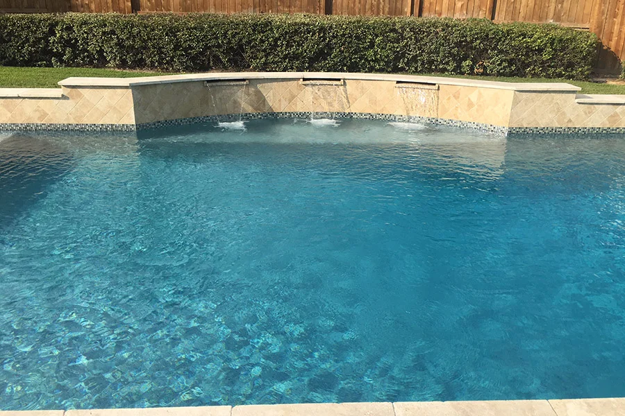 Modernized pool with sheer descent waterfalls and LED lights Modernized pool with sheer descent waterfalls and LED lights