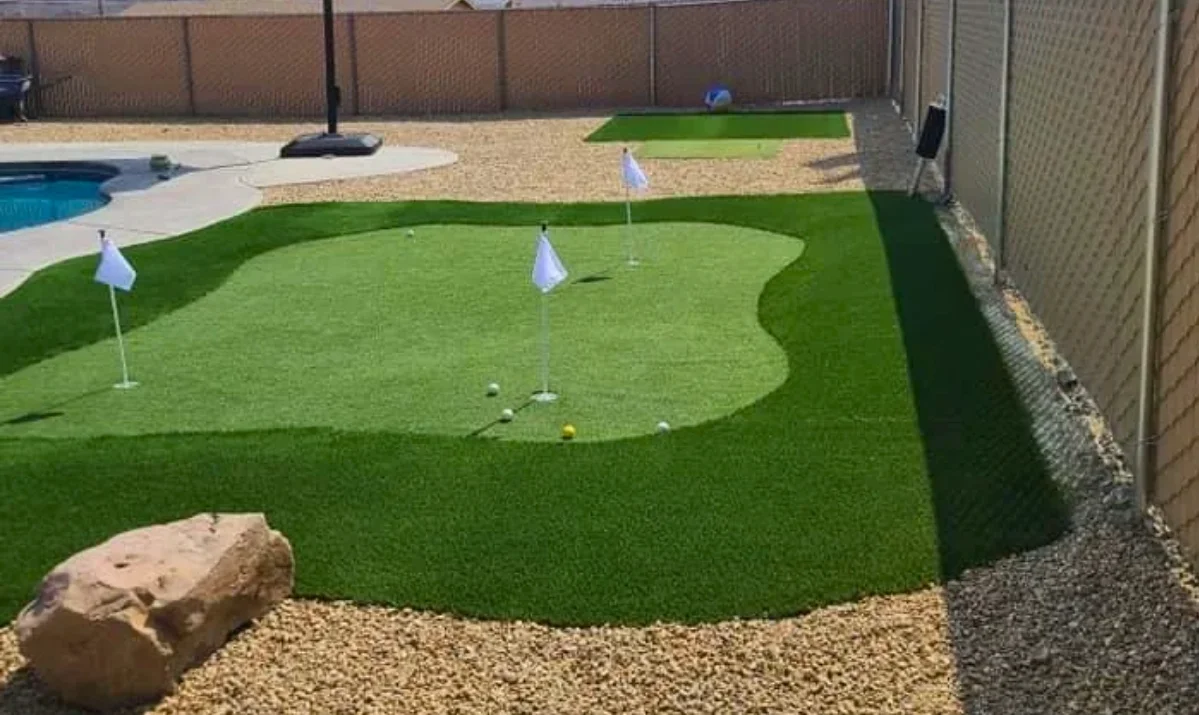 a custom backyard putting green in Lake Havasu Arizona surrounded by clean desert landscaping a custom backyard putting green in Lake Havasu Arizona surrounded by clean desert landscaping