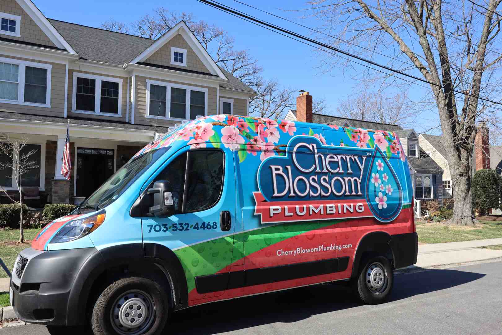 service van arriving at a home at night - plumbing service arlington