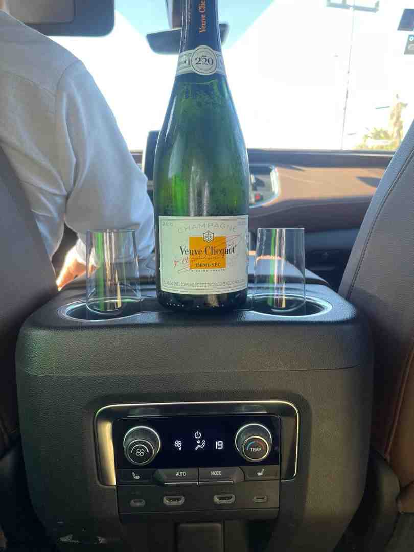 Chilled beverages being served in a private transportation van - cabo group transportation
