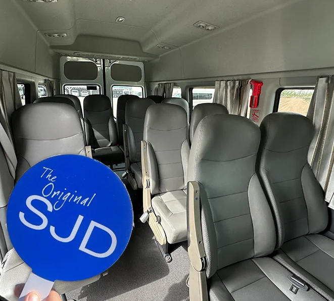 Happy travelers with cold drink in shuttle - sjd taxi reviews Happy travelers with cold drink in shuttle - sjd taxi reviews