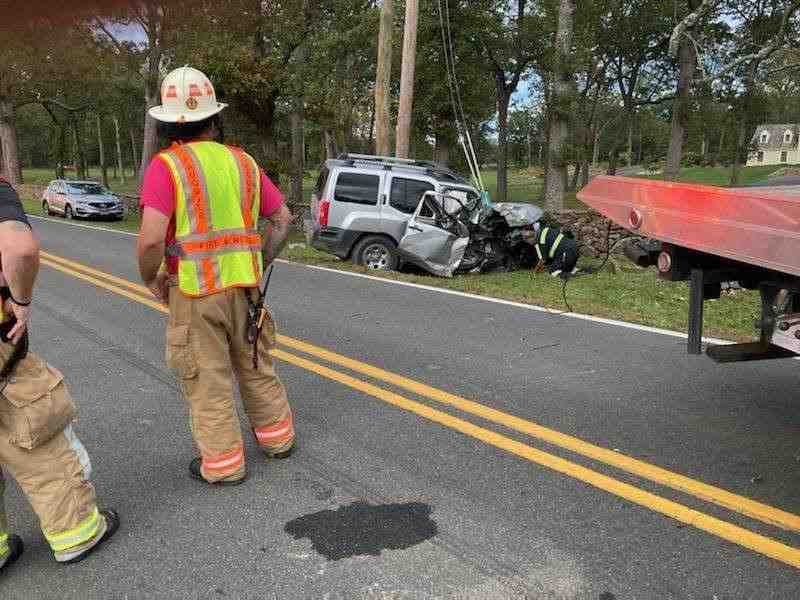 A car accident scene on a Richmond street with emergency services present and traffic cones. - accident lawyers in richmond virginia A car accident scene on a Richmond street with emergency services present and traffic cones. - accident lawyers in richmond virginia