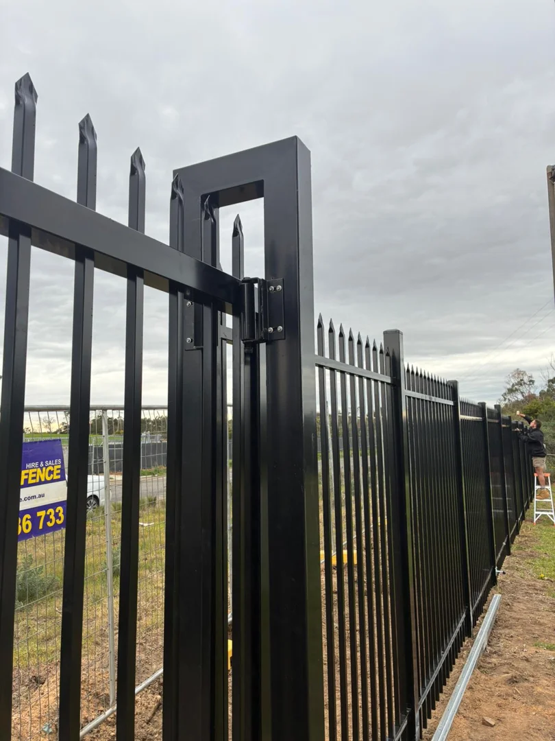 Powder coat inspection and anti-corrosion touch-up on steel fence
