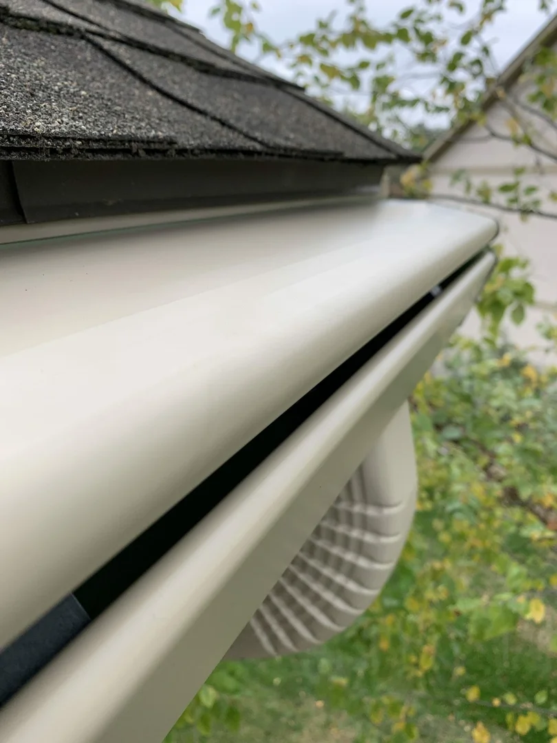 K-Guard leaf-free gutter system downspout extension routing water safely into landscaping K-Guard leaf-free gutter system downspout extension routing water safely into landscaping